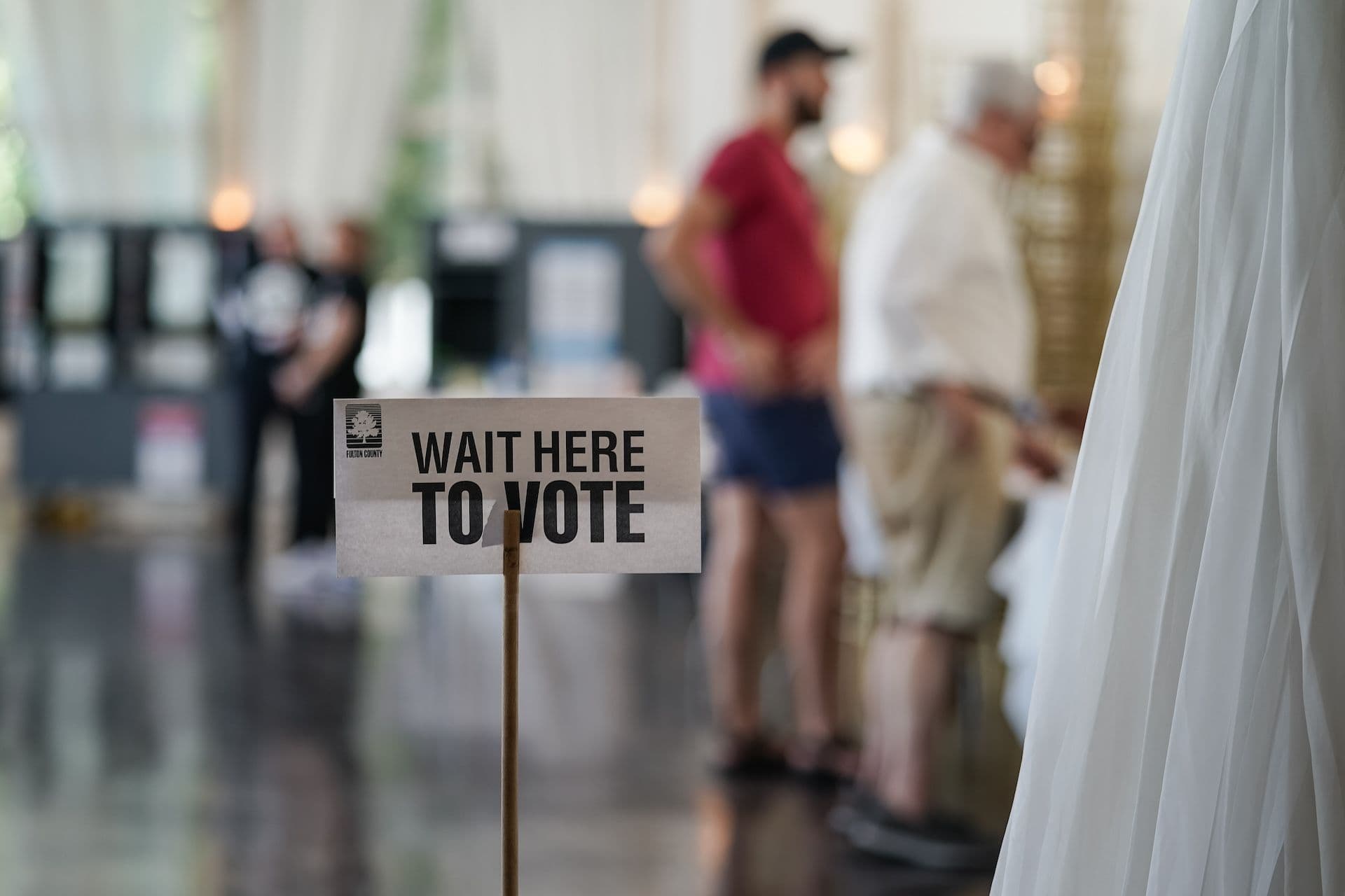 'Wait Here To Vote' sign