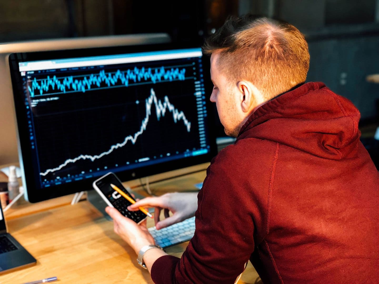 CDCROP: man in front of computer screen with falling line graph (Chris Liverani/Unsplash)