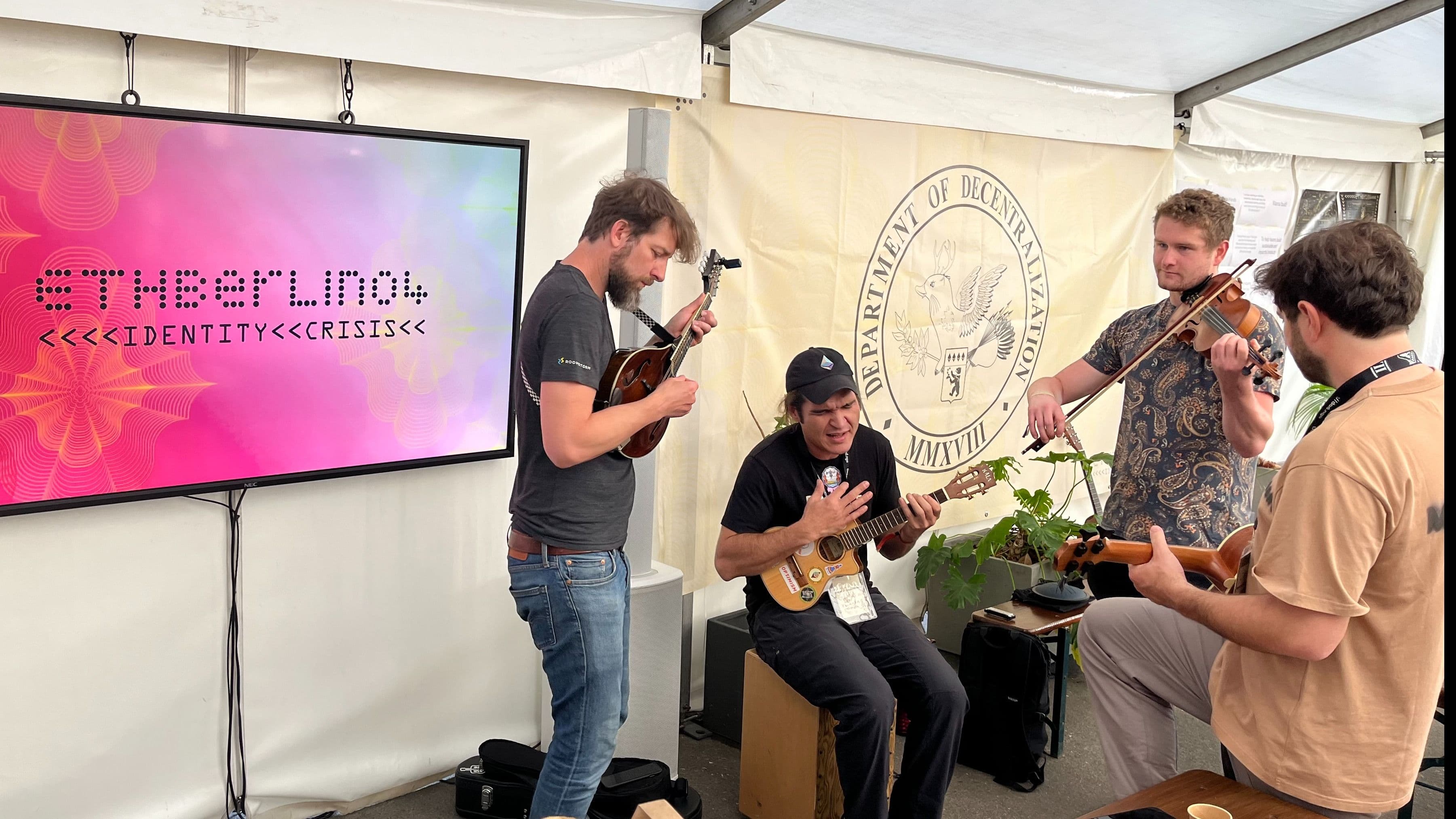 A mix of volunteers and hackers at EthBerlin playing music.