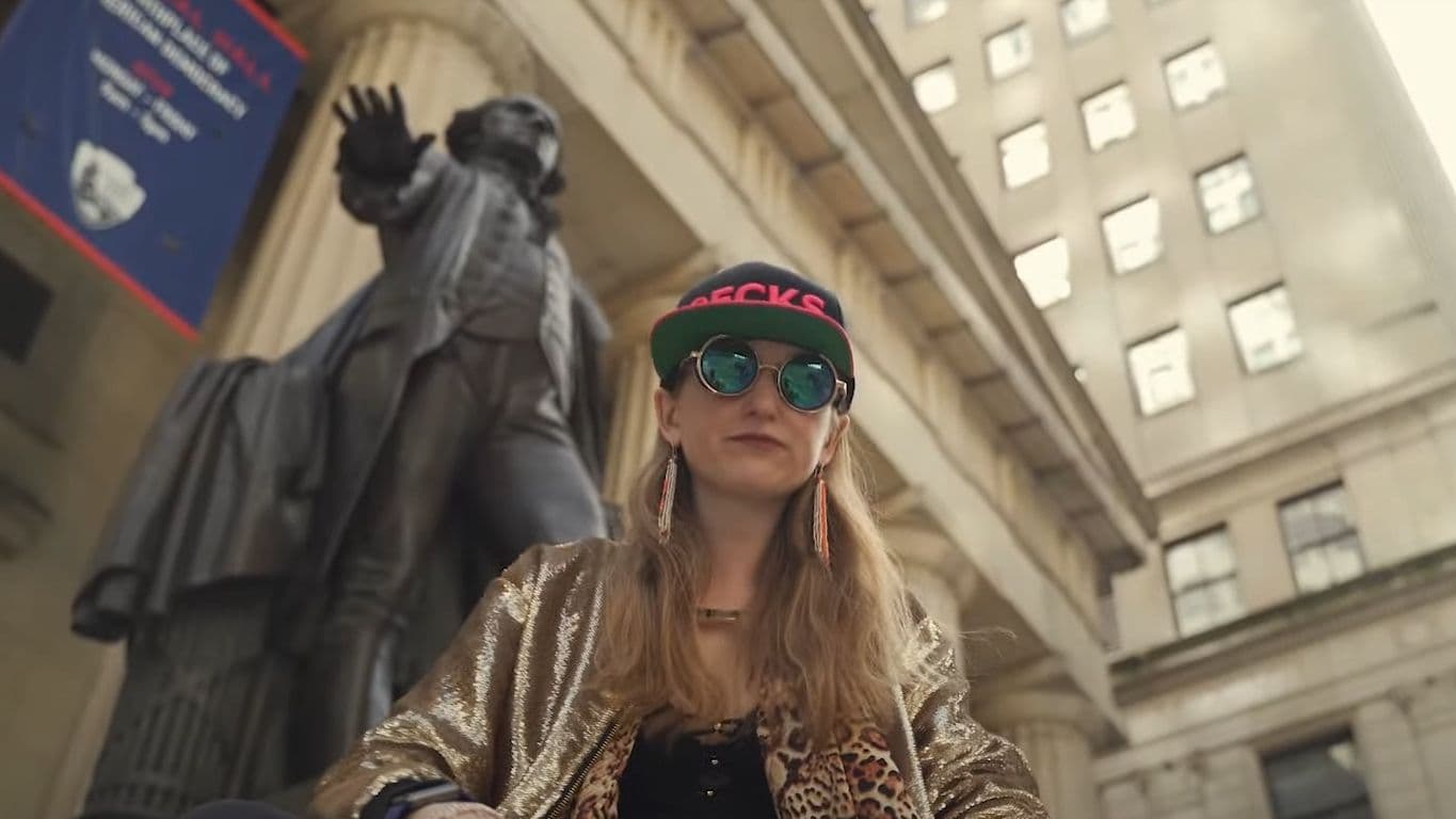 16:9CROP Heather "Razzlekhan" Morgan, from her video "Rap Anthem for Misfits & Weirdos: Versace Bedouin Music Video (2019)" (Razzlekhan on YouTube)