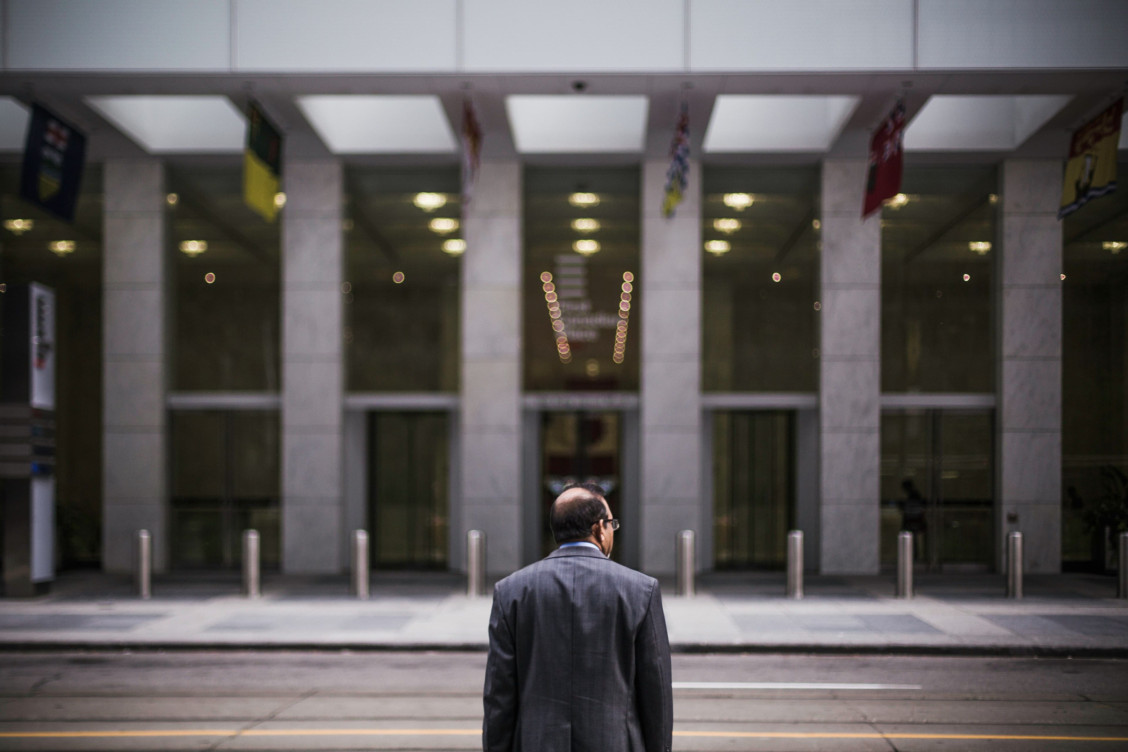 Man outside financial building