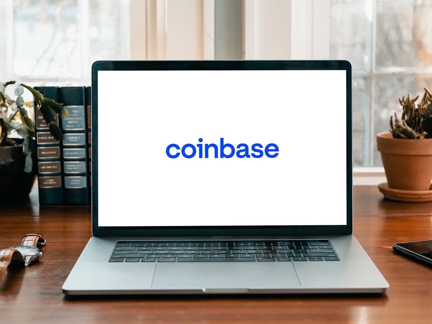 Coinbase logo on a laptop computer (Piggybank/Unsplash)