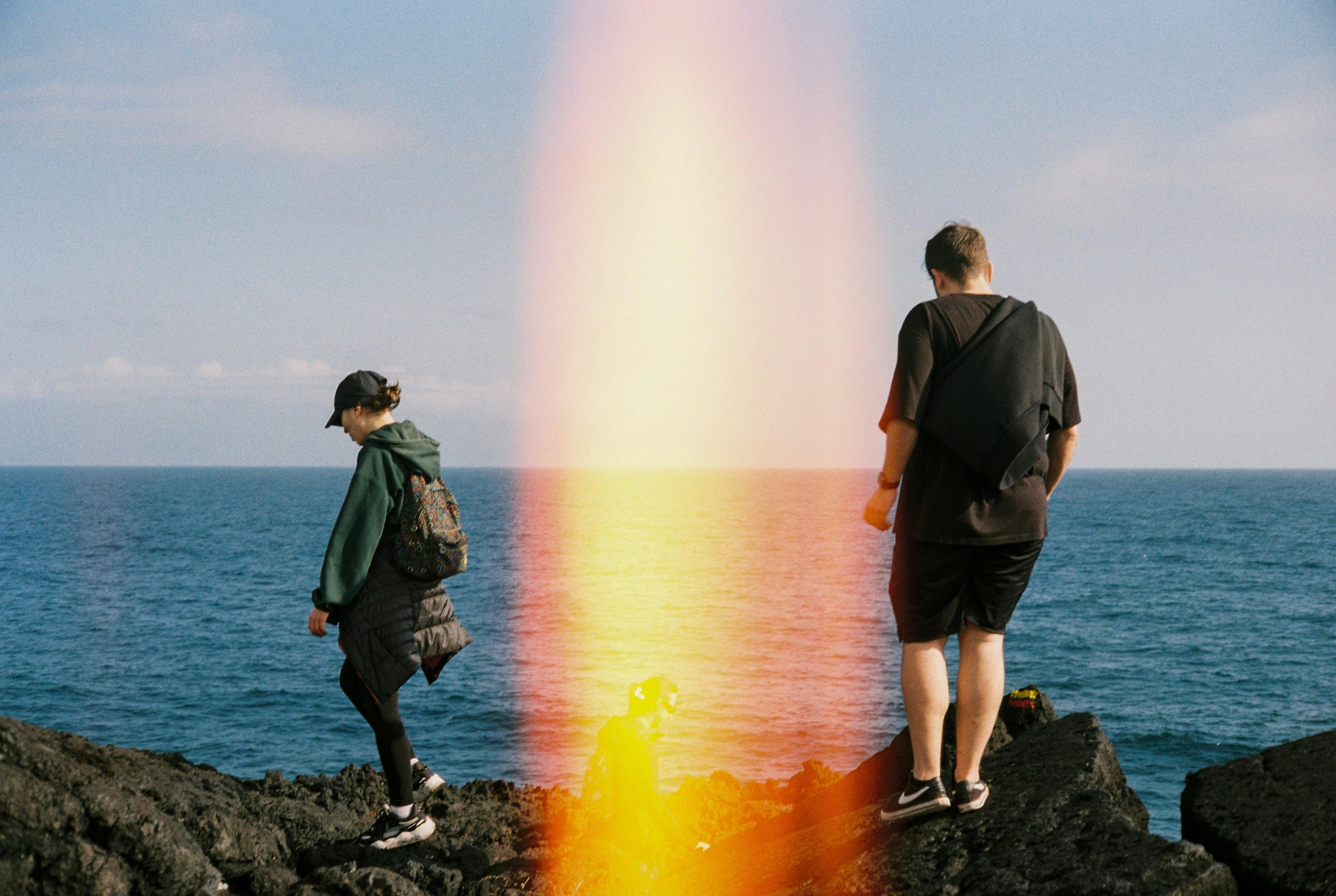 People standing near ocean