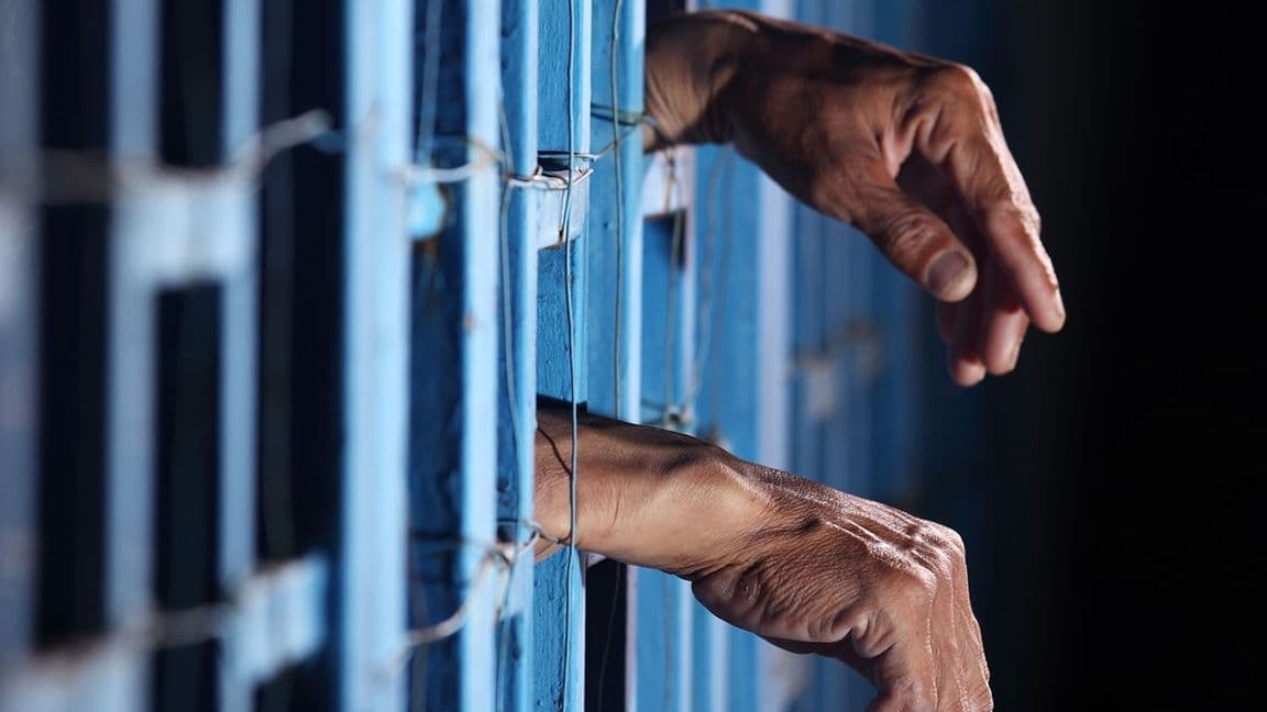 16:9: Man arrested behind bars in jail (Shutterstock)