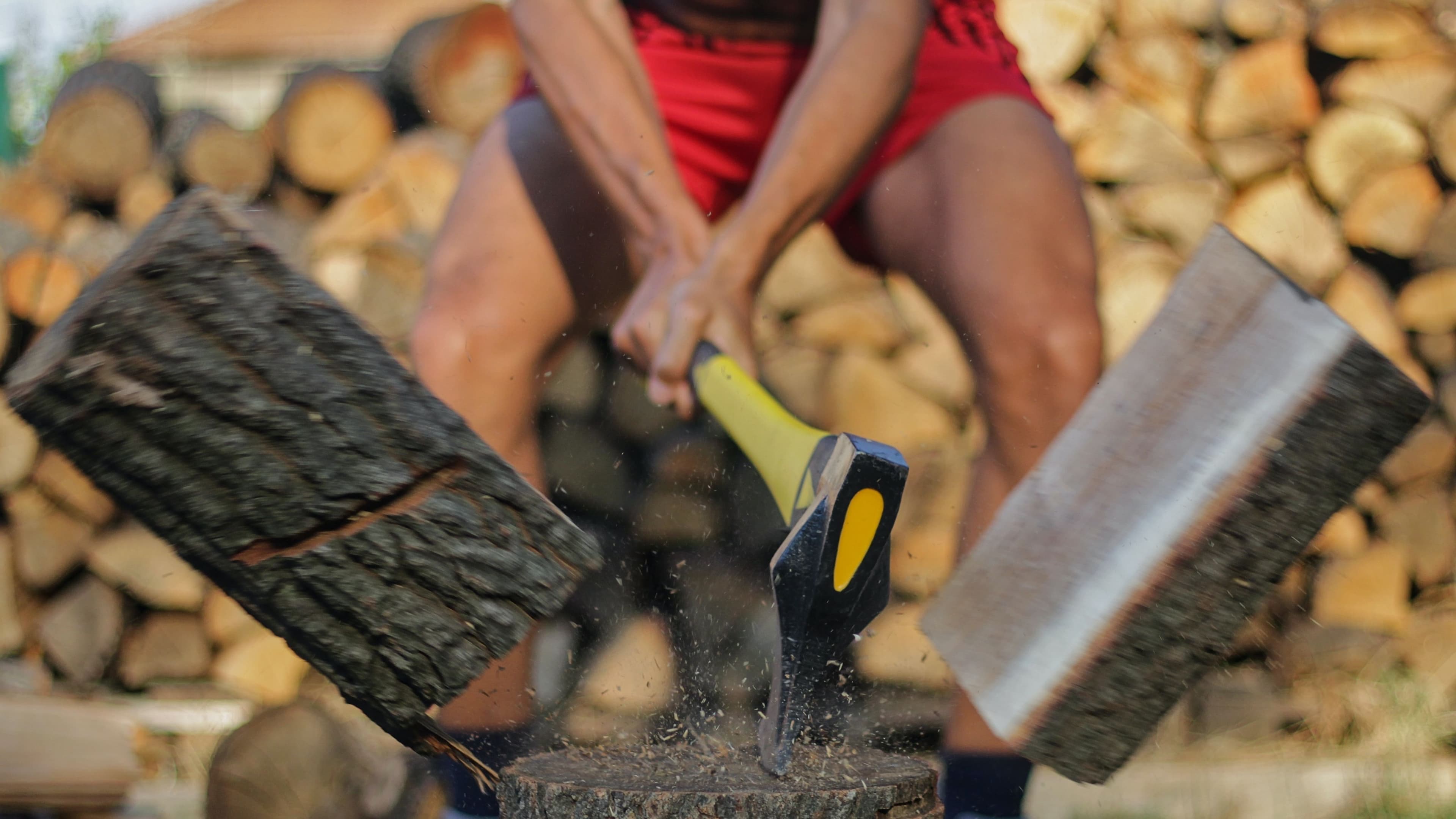 (16:9 CROP) axe splitting, halving log (Zhivko Minkov/Unsplash)