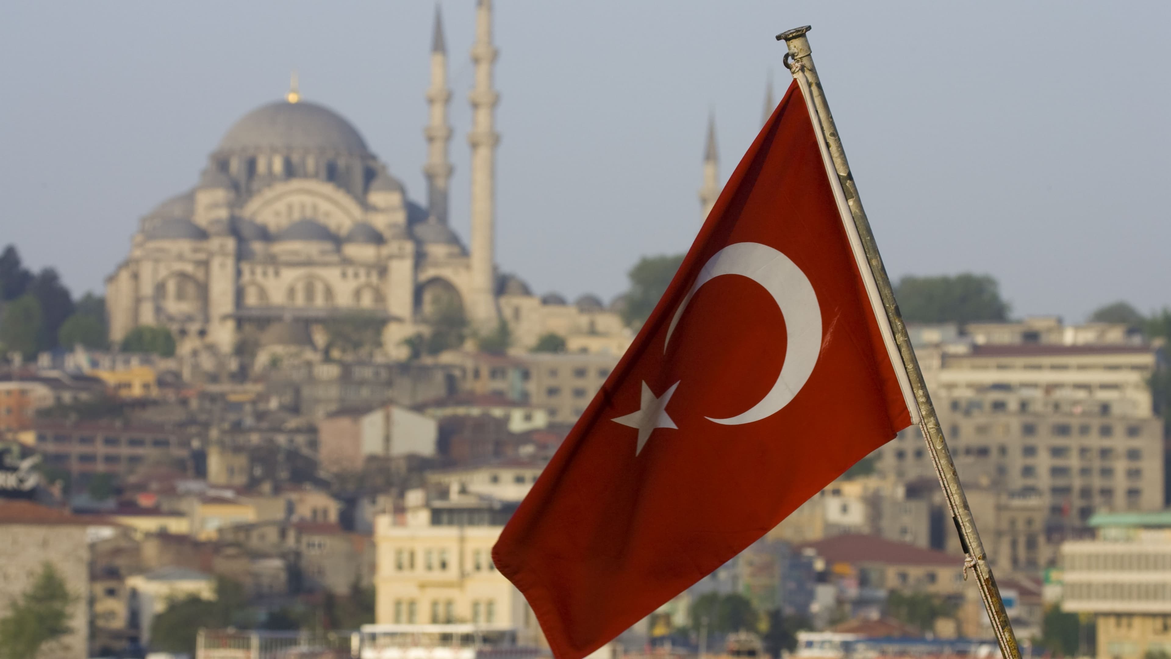 16:9 crop Turkish Flag and Mosque just above the Bosphorus (Getty Images)