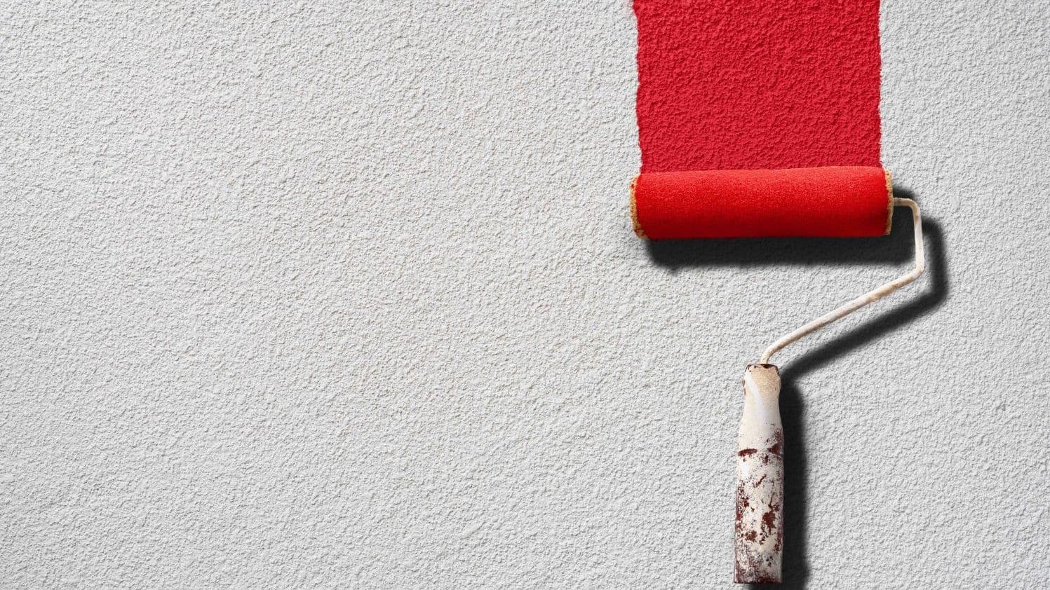 Fresh red paint on a white wall.