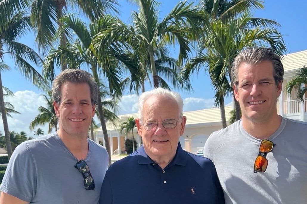 Tyler and Cameron Winklevoss with their father, Howard