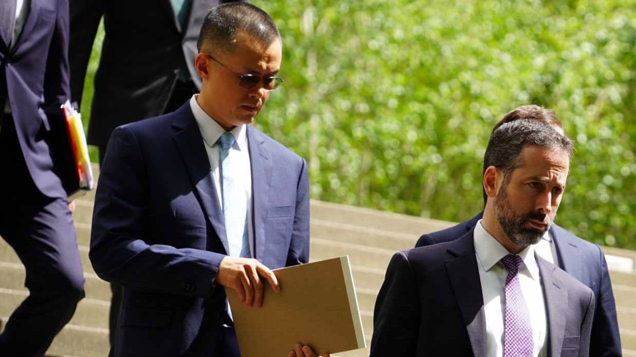 Binance founder Changpeng Zhao, left, exits a Seattle courthouse after being sentenced to four months in prison. (Danny Nelson/CoinDesk)